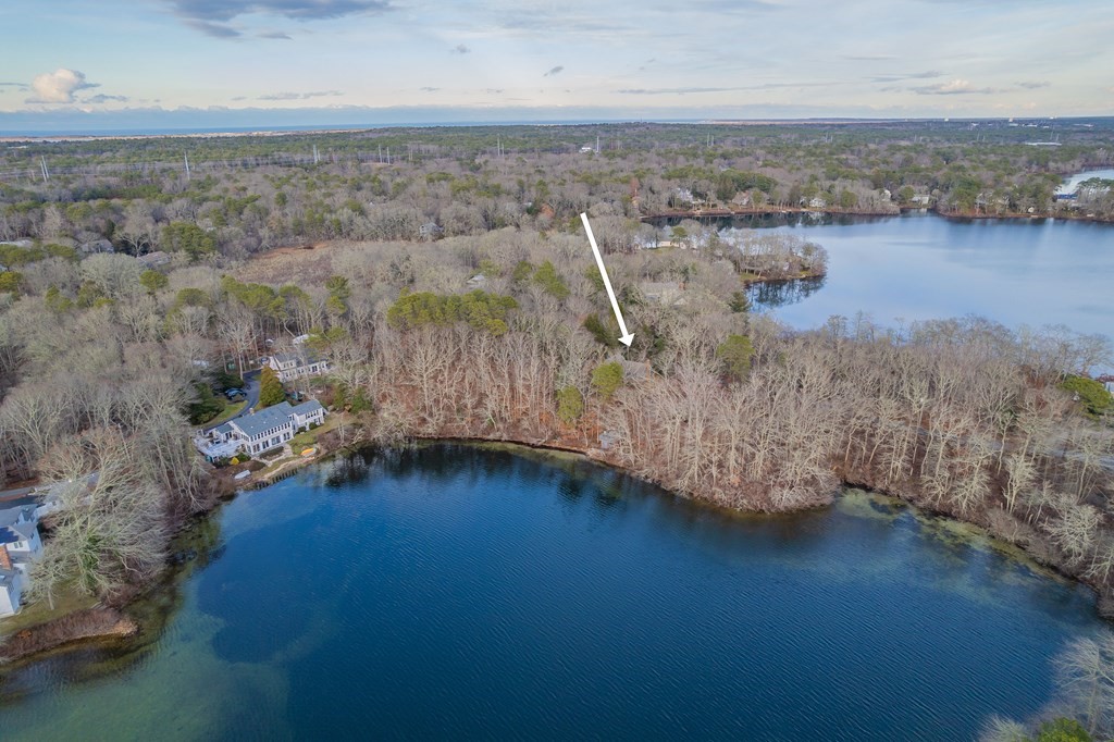 141 Nyes Neck Road Barnstable, MA 02632 - Photo 3 of 31 an aerial view of residential houses with outdoor space and lake view