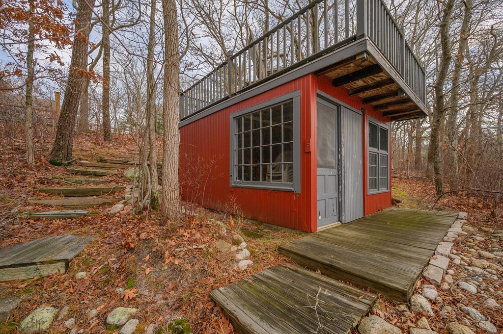 141 Nyes Neck Road Barnstable, MA 02632 - Photo 10 of 31 a front view of a house with a yard