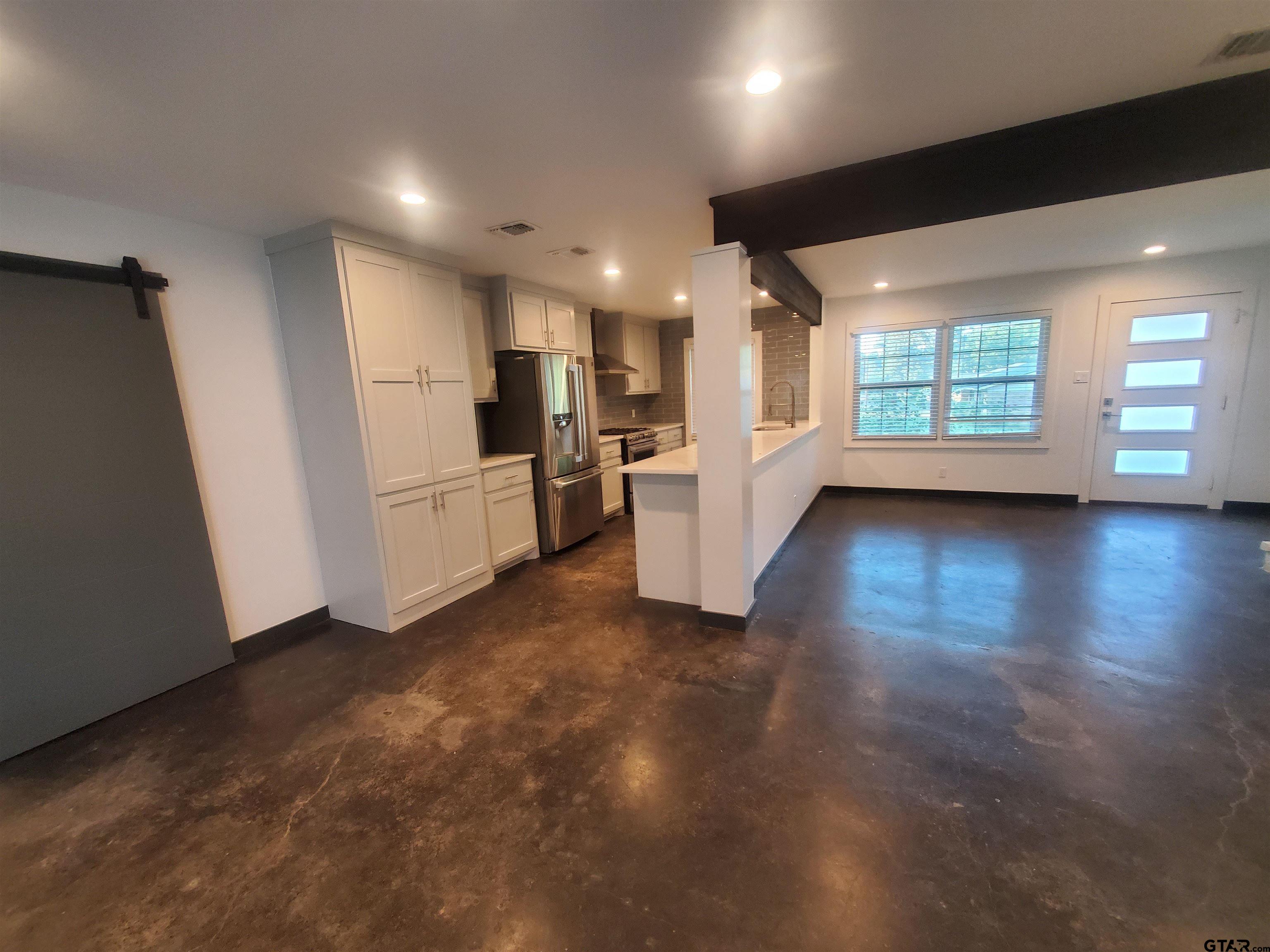 2917 Amy Lane Tyler, TX 75701 - Photo 16 of 36 a view of empty room with wooden floor and window