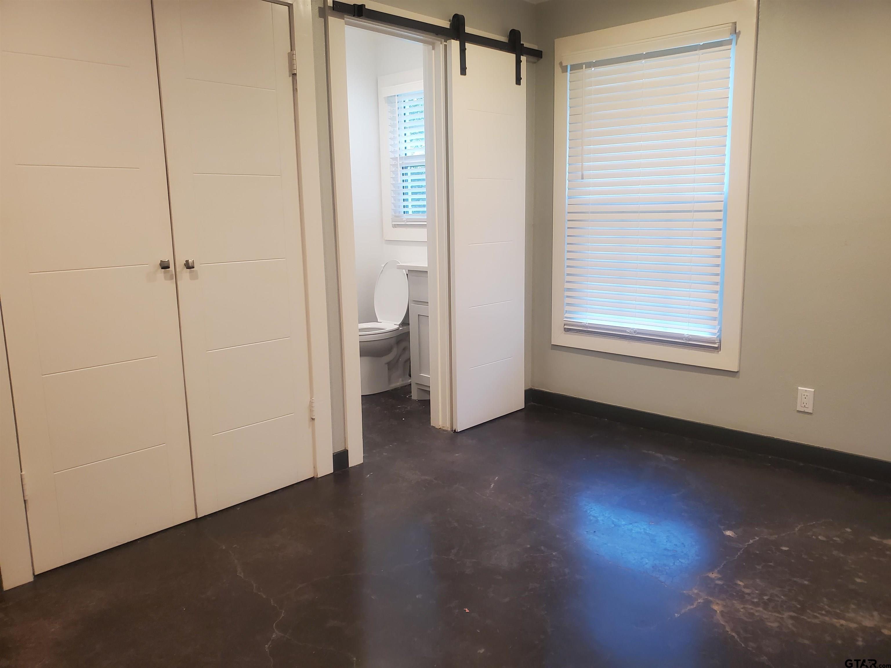 2917 Amy Lane Tyler, TX 75701 - Photo 20 of 36 a view of an empty room with a fireplace and a window