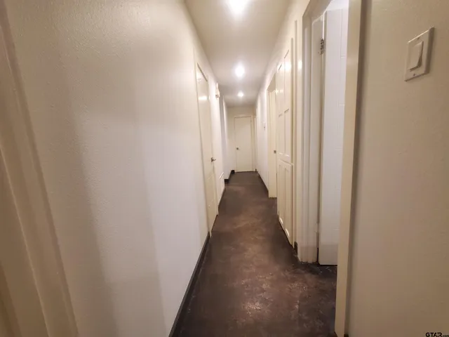 a view of a hallway with a glass door