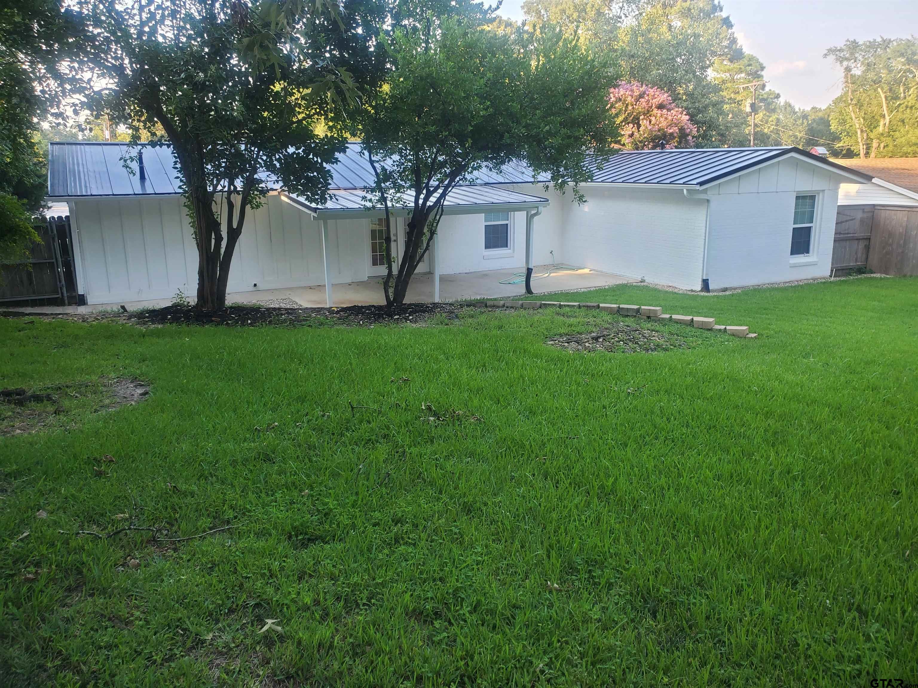 2917 Amy Lane Tyler, TX 75701 - Photo 32 of 36 a front view of house with yard and green space