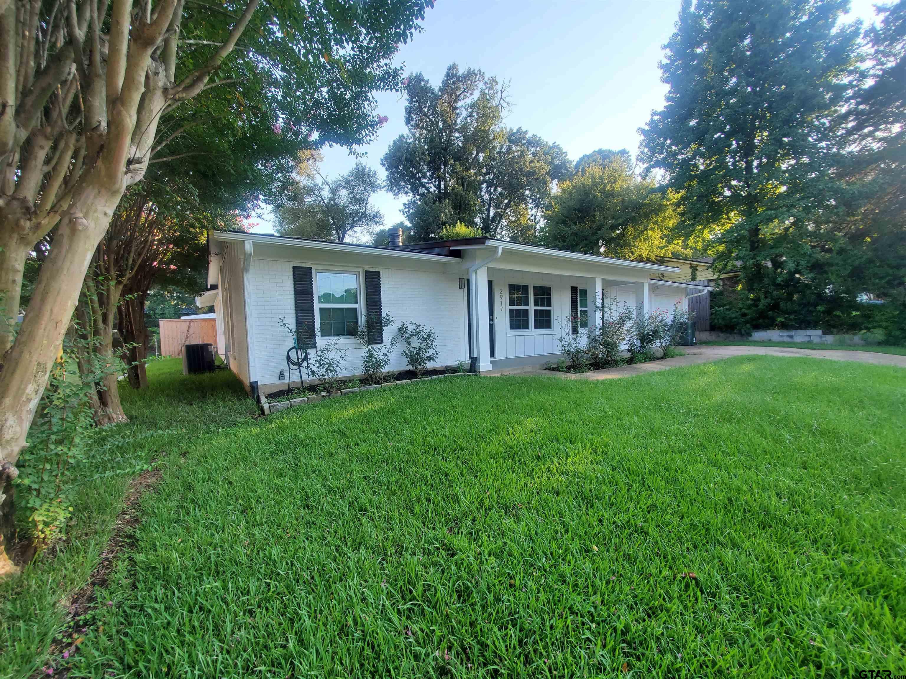 2917 Amy Lane Tyler, TX 75701 - Photo 4 of 36 front view of a house with a yard