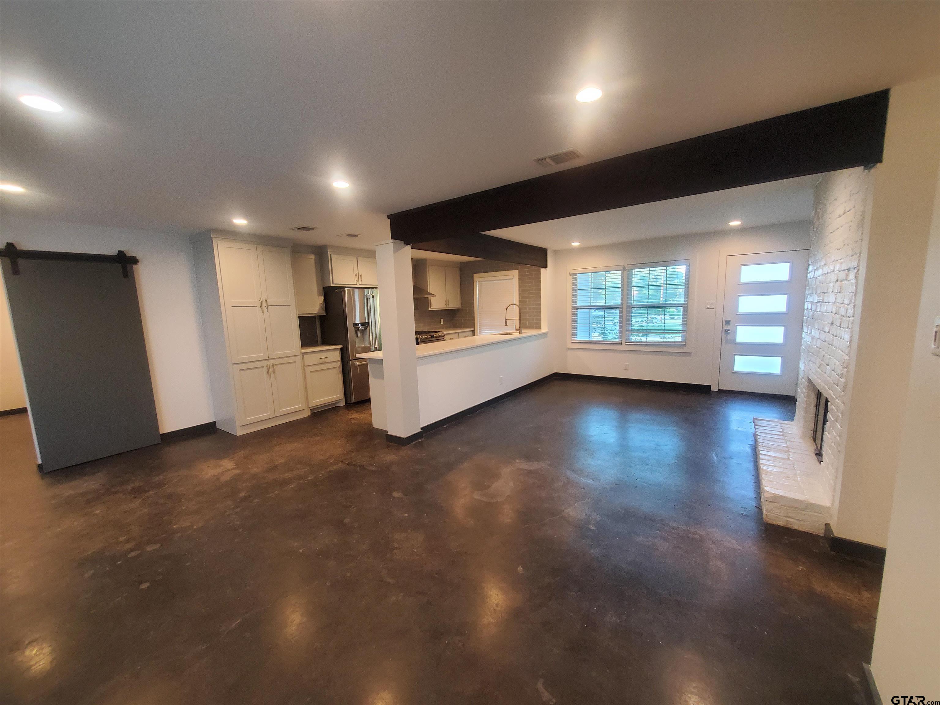 2917 Amy Lane Tyler, TX 75701 - Photo 8 of 36 a view of empty room with wooden floor and window