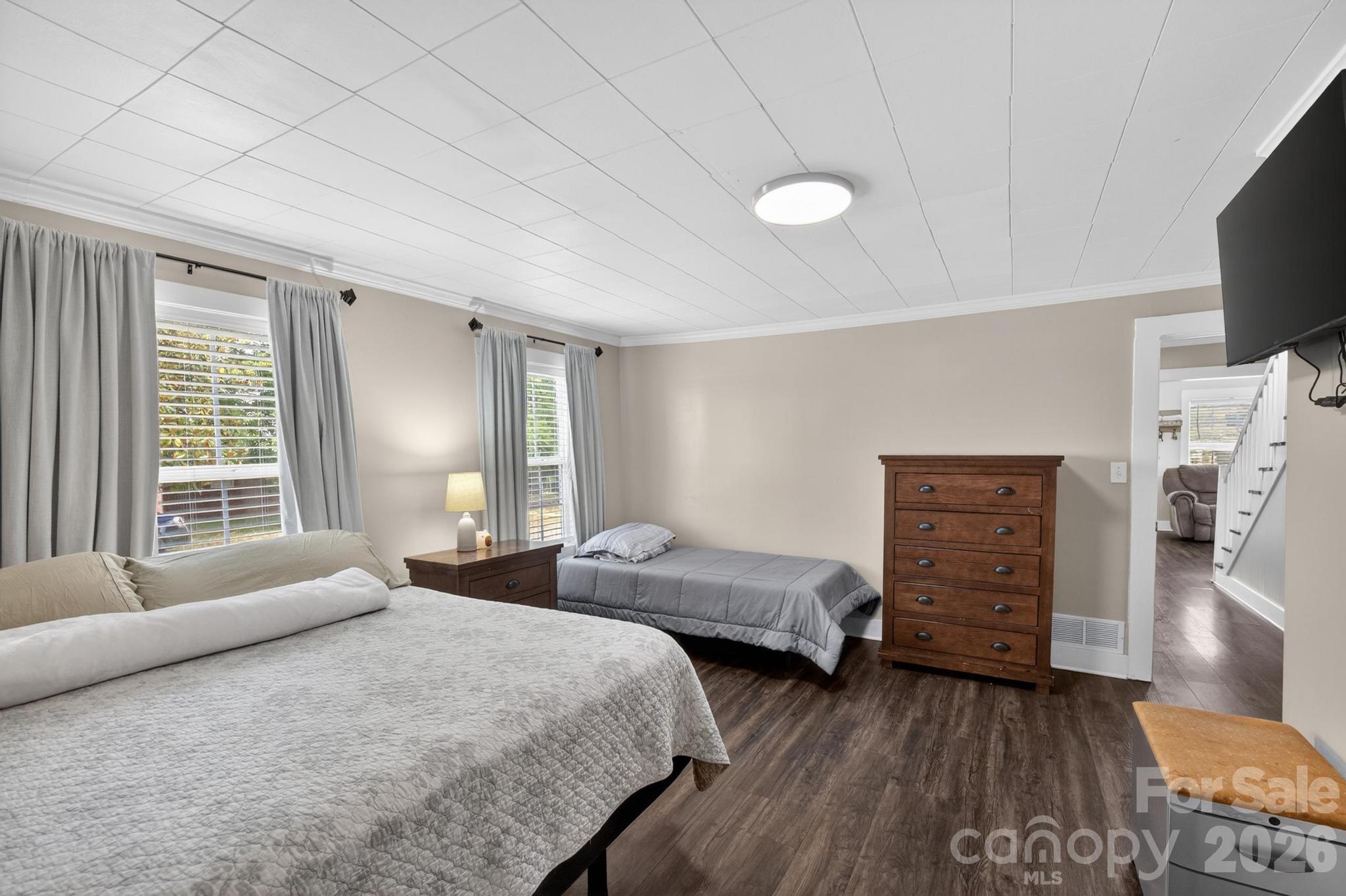 2076 Connelly Springs Road Lenoir, NC 28645 - Photo 26 of 47 a spacious bedroom with a bed and a couch
