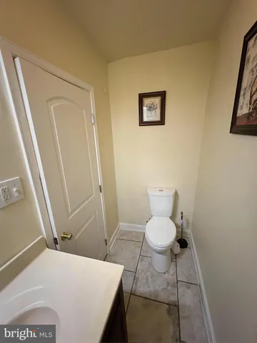 a bathroom with a toilet and a sink