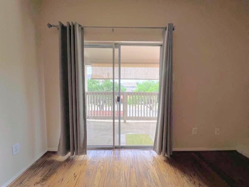 4041 Drake Street, Unit 118 Houston, TX 77005 - Photo 18 of 22 wooden floor in an empty room with a window