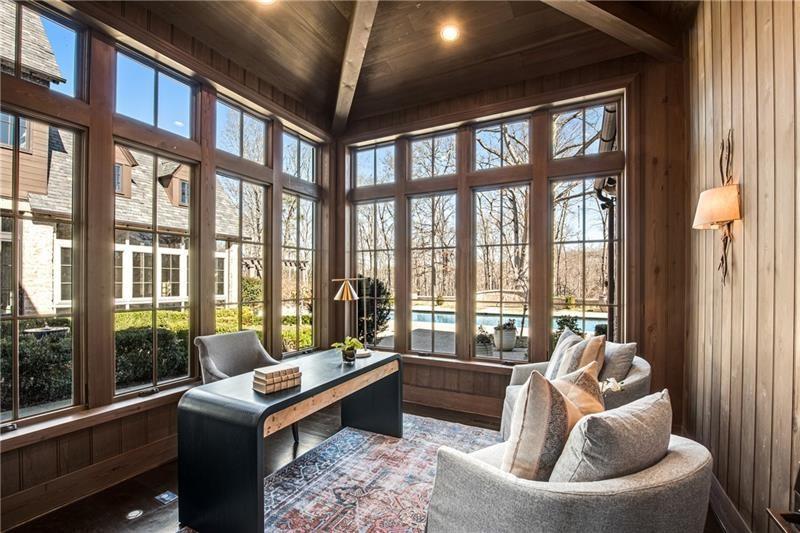 560 Lost River Bend Milton, GA 30004 - Photo 16 of 62 a living room with furniture and a floor to ceiling window