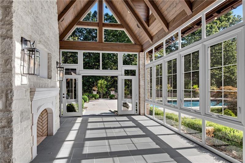 560 Lost River Bend Milton, GA 30004 - Photo 18 of 62 a front view of a building with a porch