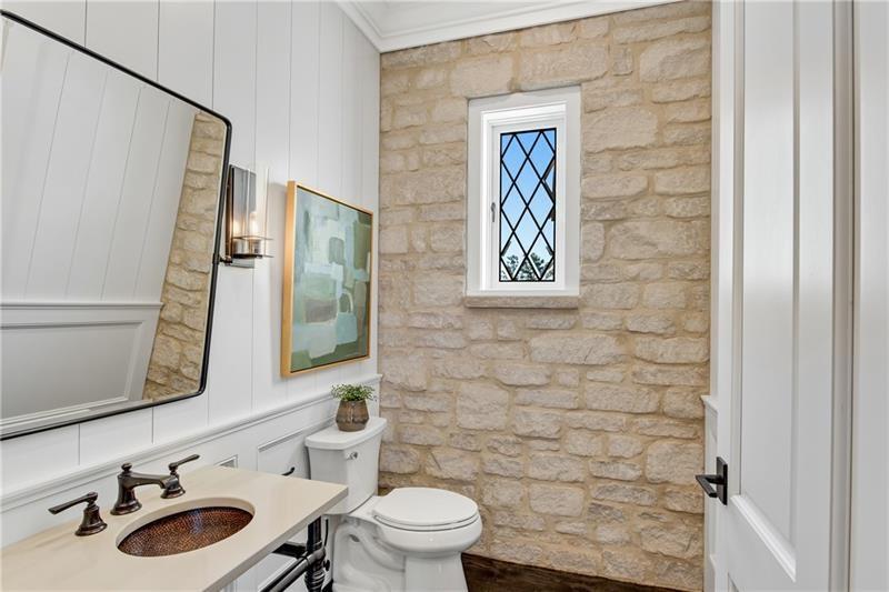 560 Lost River Bend Milton, GA 30004 - Photo 23 of 62 a bathroom with a sink a toilet and a mirror