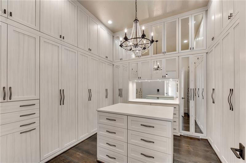 560 Lost River Bend Milton, GA 30004 - Photo 30 of 62 a view of a hallway with chandelier