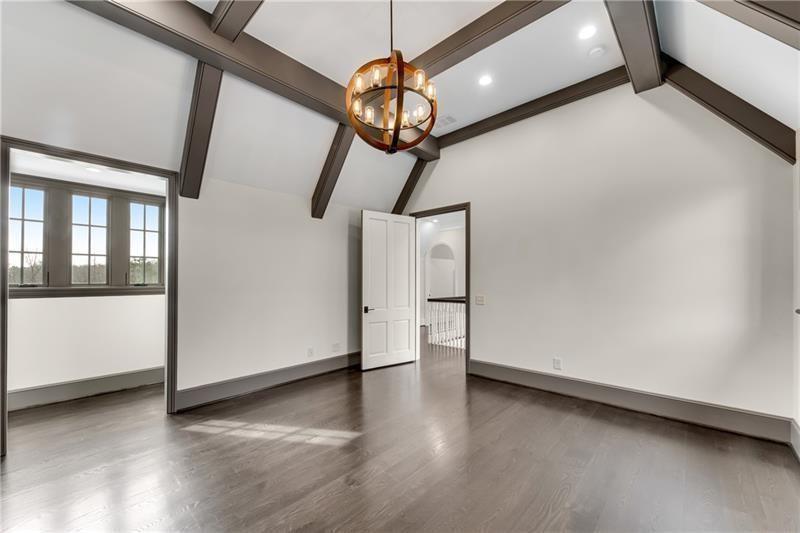 560 Lost River Bend Milton, GA 30004 - Photo 34 of 62 a view of a livingroom with wooden floor and stairs
