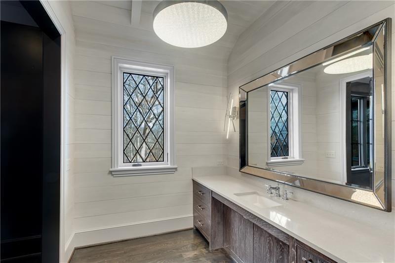 560 Lost River Bend Milton, GA 30004 - Photo 37 of 62 a bathroom with double vanity sink and a mirror