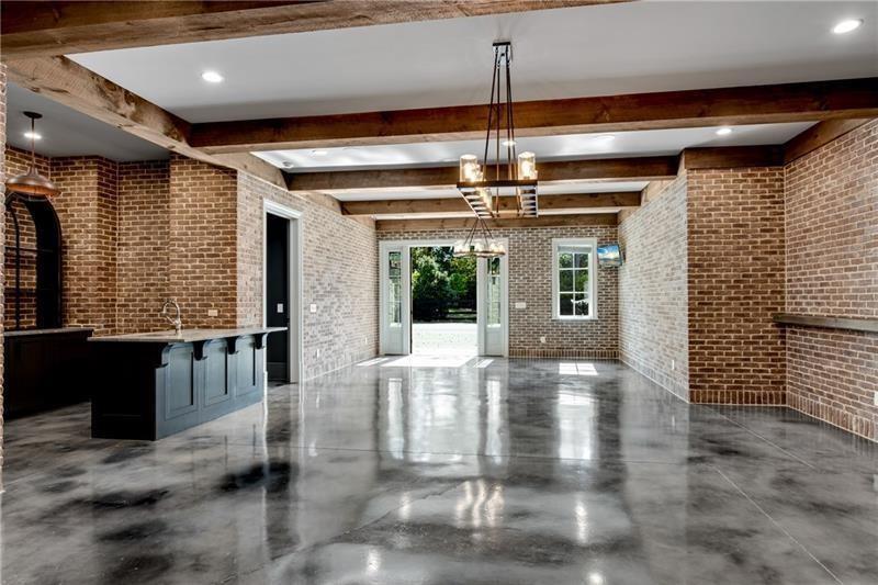 560 Lost River Bend Milton, GA 30004 - Photo 43 of 62 a view of a livingroom with a furniture wooden floor and chandelier