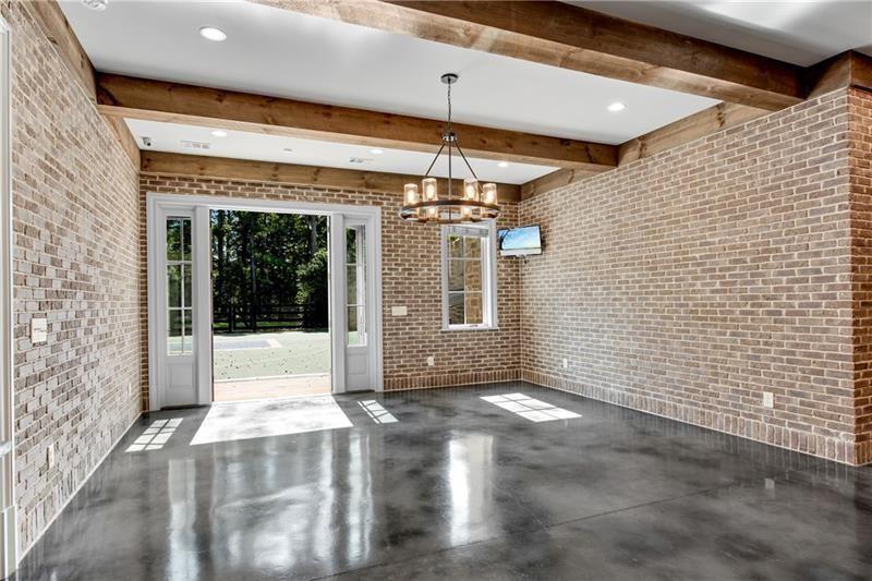 560 Lost River Bend Milton, GA 30004 - Photo 46 of 62 a view of a porch with a table and chairs