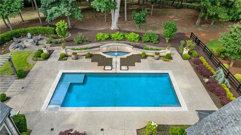 560 Lost River Bend Milton, GA 30004 - Photo 52 of 62 a view of a swimming pool with lounge chair