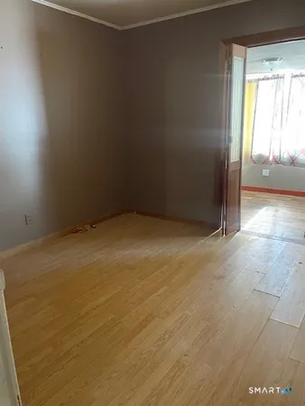 an empty room with a fireplace