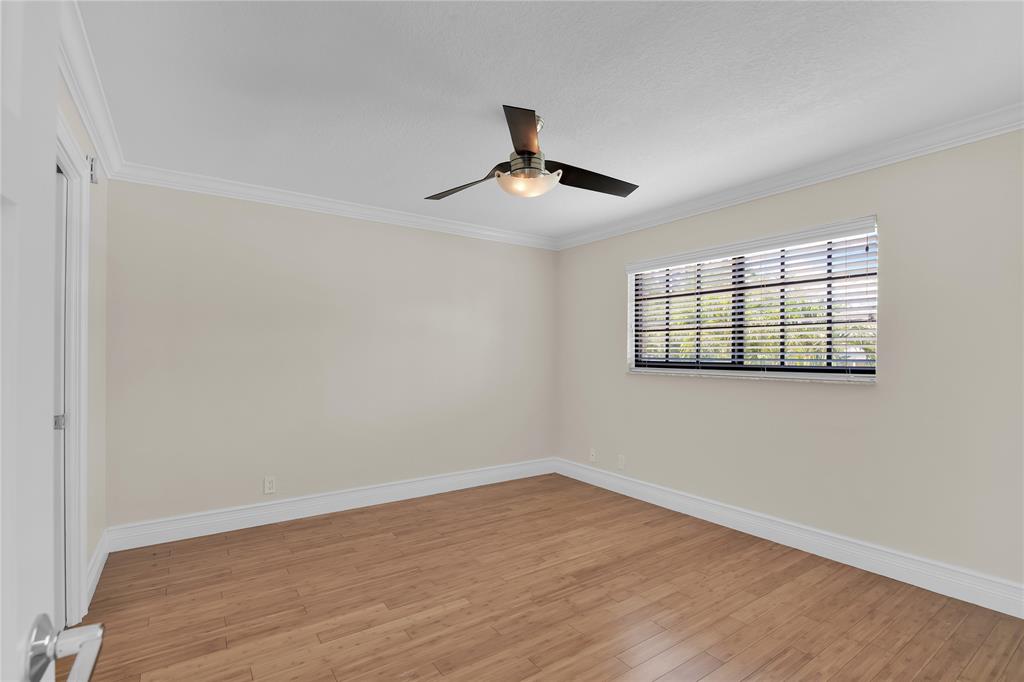 250 East Royal Palm Road, Unit 2A Boca Raton, FL 33432 - Photo 12 of 26 a view of empty room with wooden floor and fan