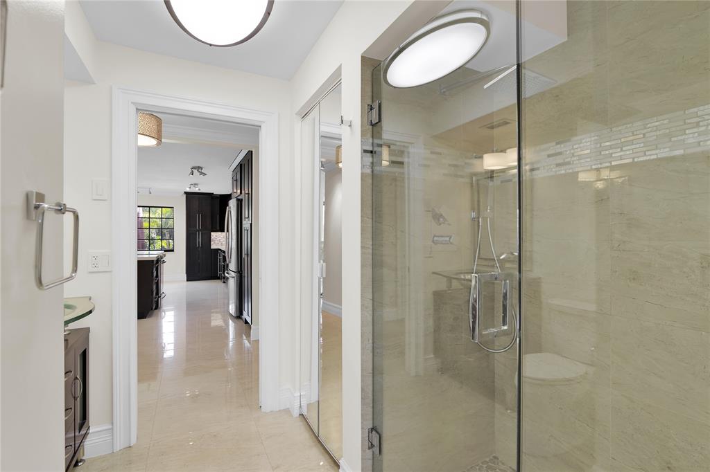 250 East Royal Palm Road, Unit 2A Boca Raton, FL 33432 - Photo 13 of 26 a bathroom with a shower and a mirror