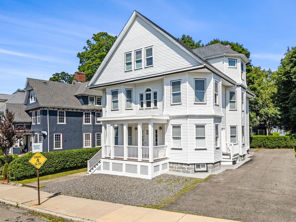 24 Bentley Street, Unit 1 Boston, MA 02135 - Photo 1 of 21 a front view of a house with a garden