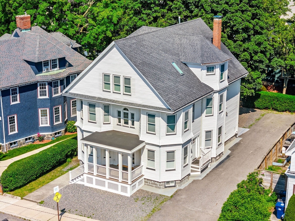 24 Bentley Street, Unit 1 Boston, MA 02135 - Photo 19 of 21 a aerial view of a house with a yard and potted plants