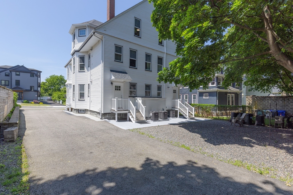 24 Bentley Street, Unit 1 Boston, MA 02135 - Photo 21 of 21 a view of a house with a patio