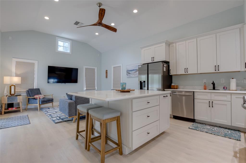 448 Locklie Street Dunedin, FL 34698 - Photo 14 of 51 a kitchen with sink microwave and stove