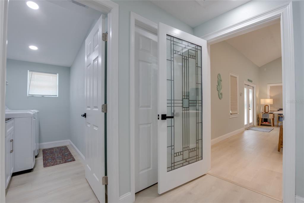 448 Locklie Street Dunedin, FL 34698 - Photo 17 of 51 a view of a hallway with closet and bathroom