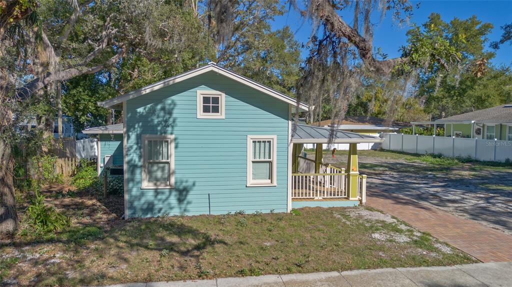 448 Locklie Street Dunedin, FL 34698 - Photo 2 of 51 a view of a house with a yard