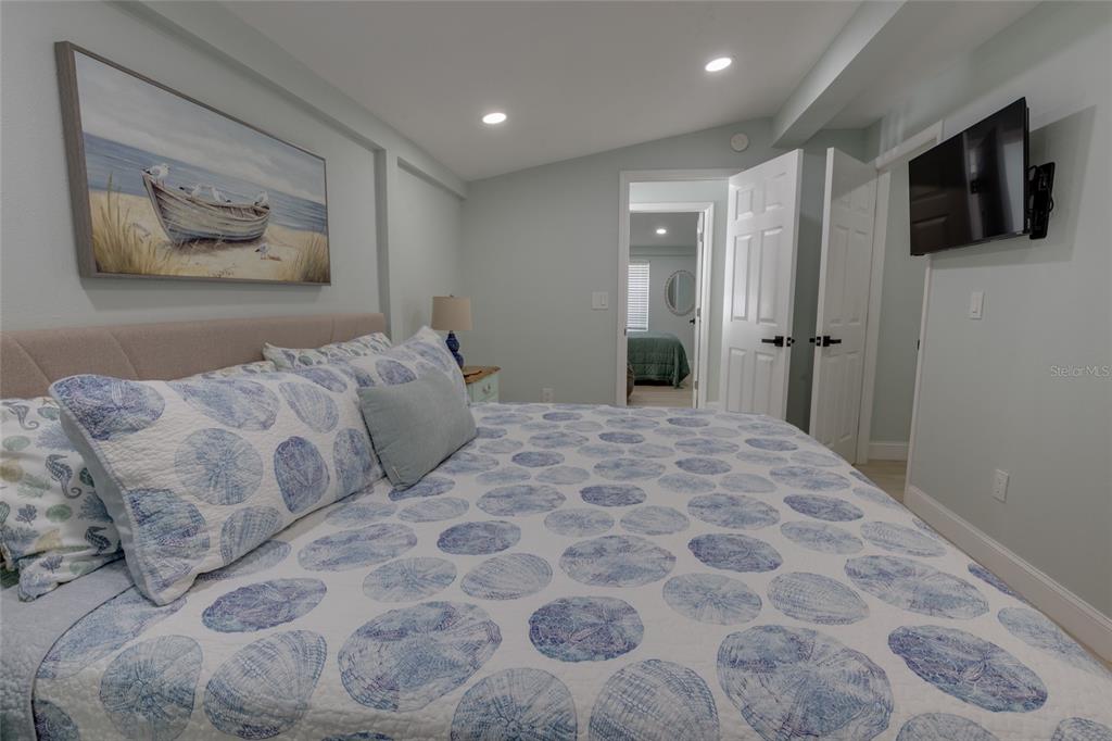 448 Locklie Street Dunedin, FL 34698 - Photo 23 of 51 a bedroom with a large bed