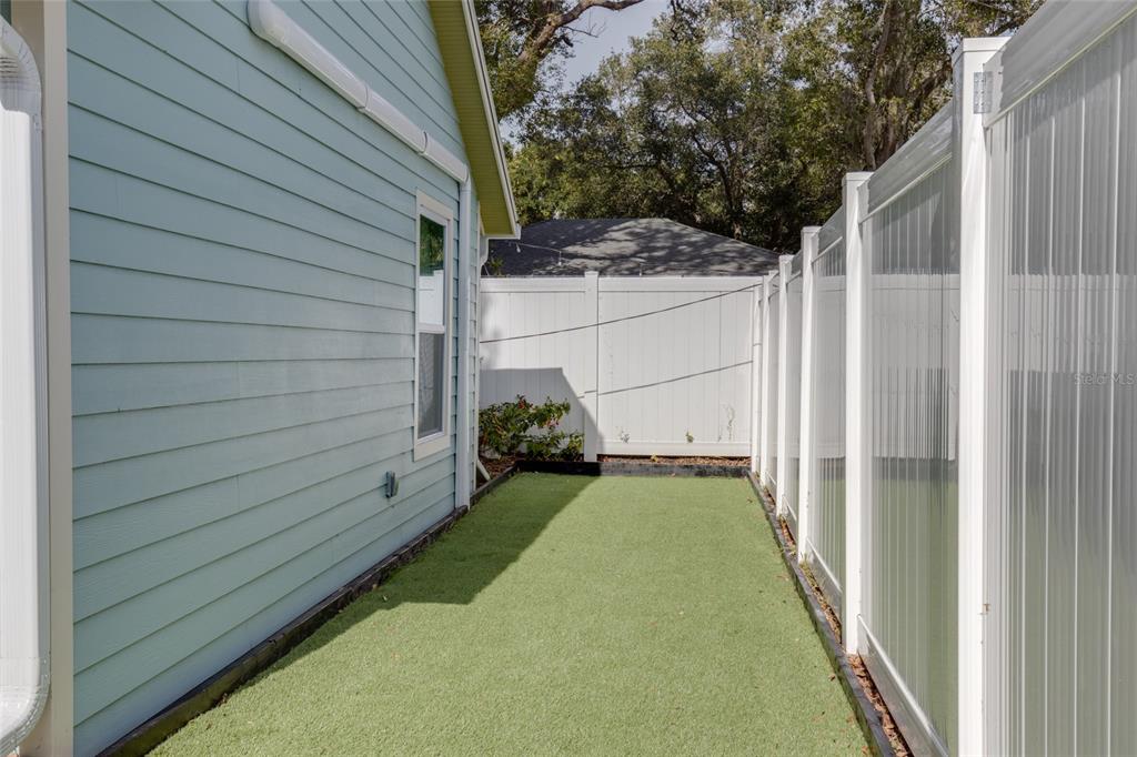 448 Locklie Street Dunedin, FL 34698 - Photo 35 of 51 a view of a backyard with door