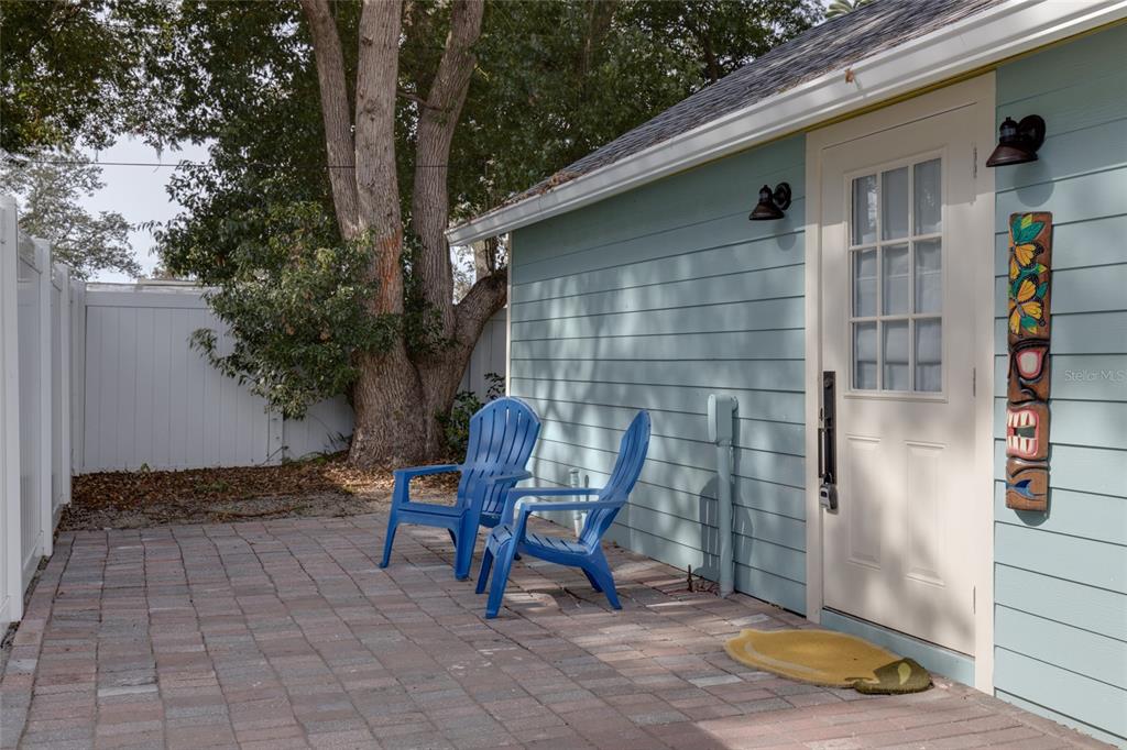 448 Locklie Street Dunedin, FL 34698 - Photo 36 of 51 a backyard of a house with chairs and table