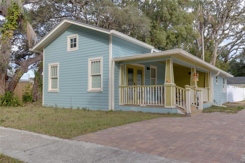 448 Locklie Street Dunedin, FL 34698 - Photo 4 of 51 a front view of a house with a yard