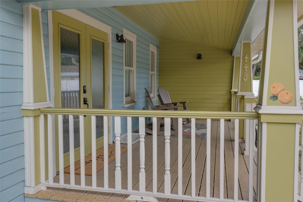 448 Locklie Street Dunedin, FL 34698 - Photo 5 of 51 a view of a porch with wooden floor