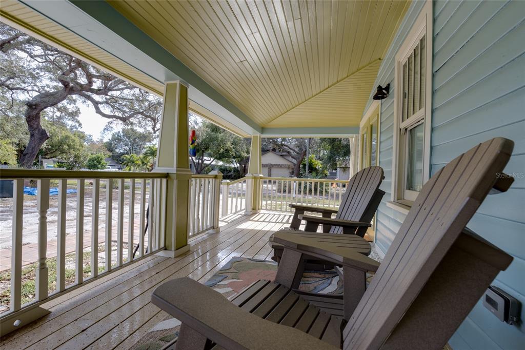 448 Locklie Street Dunedin, FL 34698 - Photo 7 of 51 a view of balcony with wooden floor and outdoor seating