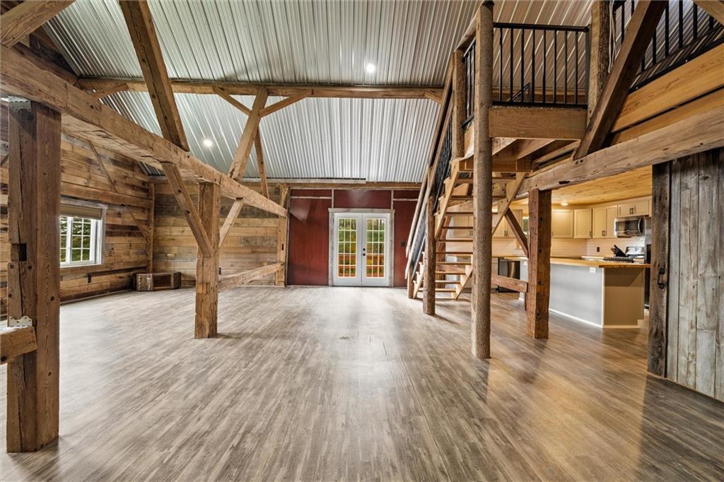10019 Dingman Road Guys Mills, PA 16327 - Photo 11 of 50 a view of an empty room with wooden floor and a window