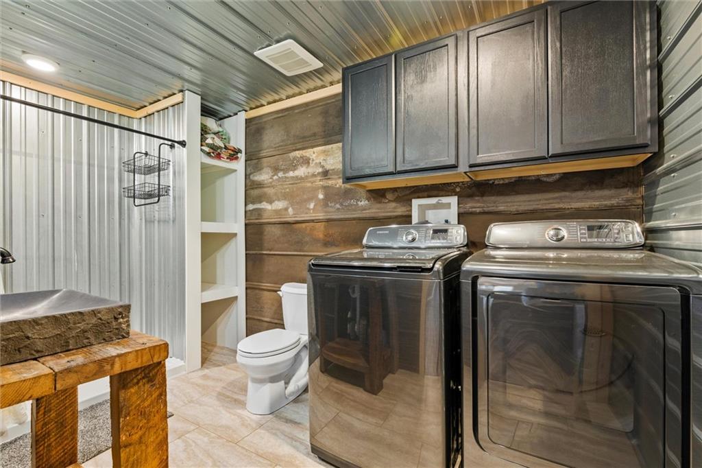10019 Dingman Road Guys Mills, PA 16327 - Photo 12 of 50 a kitchen with stainless steel appliances granite countertop a stove and a refrigerator