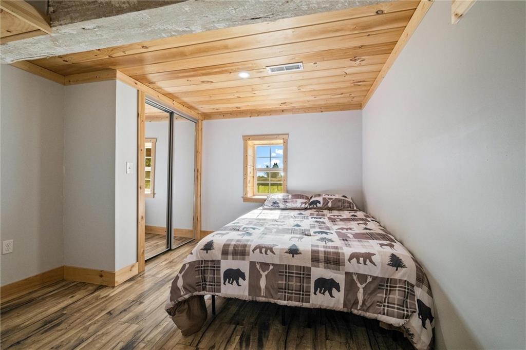 10019 Dingman Road Guys Mills, PA 16327 - Photo 22 of 50 a bedroom with a bed next to a window