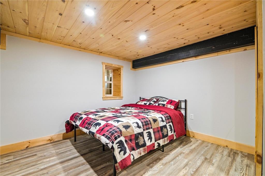 10019 Dingman Road Guys Mills, PA 16327 - Photo 23 of 50 a bedroom with a bed and wooden floor