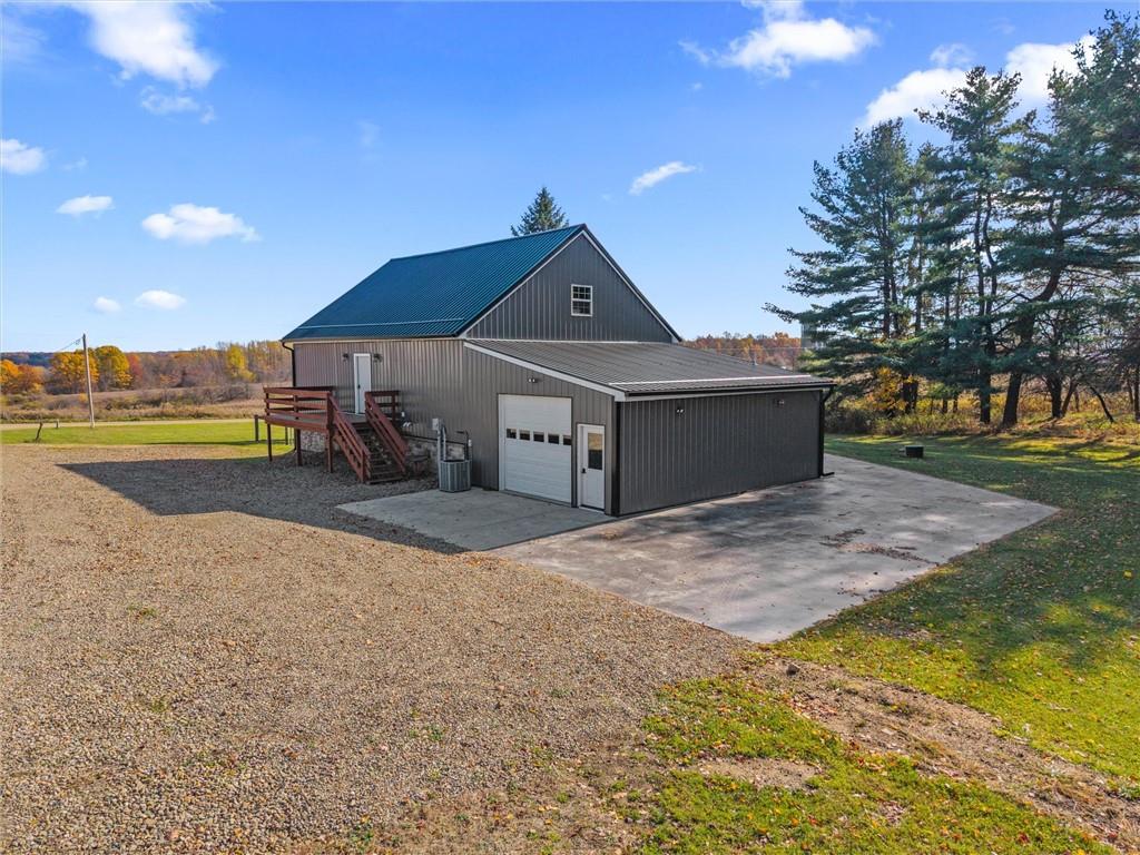 10019 Dingman Road Guys Mills, PA 16327 - Photo 29 of 50 a front view of a house with a yard