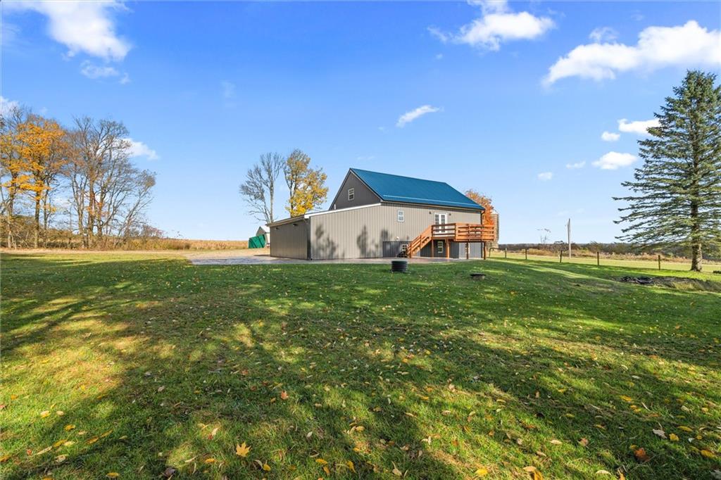 10019 Dingman Road Guys Mills, PA 16327 - Photo 33 of 50 a front view of a house with garden