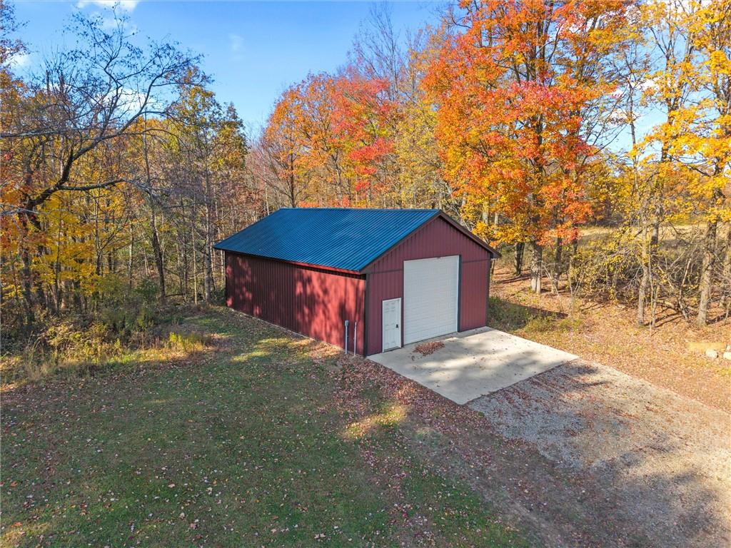 10019 Dingman Road Guys Mills, PA 16327 - Photo 34 of 50 a house with trees in the background