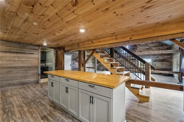 a kitchen with stainless steel appliances granite countertop a stove and a refrigerator