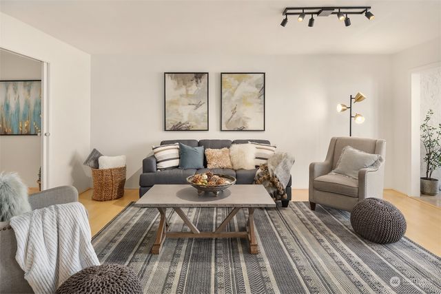 a living room with furniture and a rug