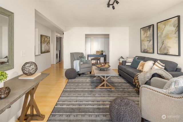 a living room with furniture and a rug