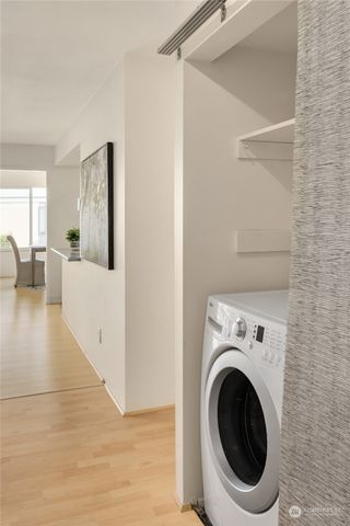 a view of a hallway with washer and dryer