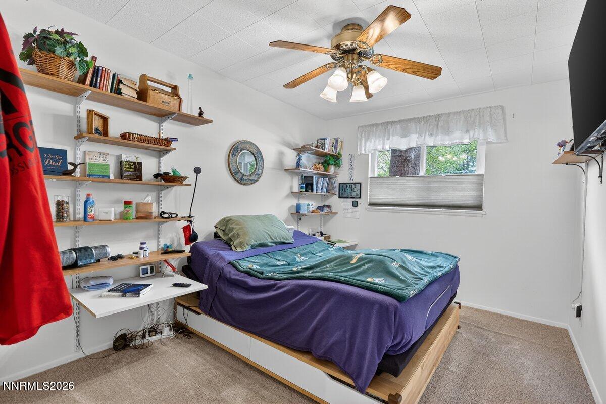 1945 4th Street, Unit 3 Sparks, NV 89431 - Photo 11 of 20 a bed room with a bed window and a chair