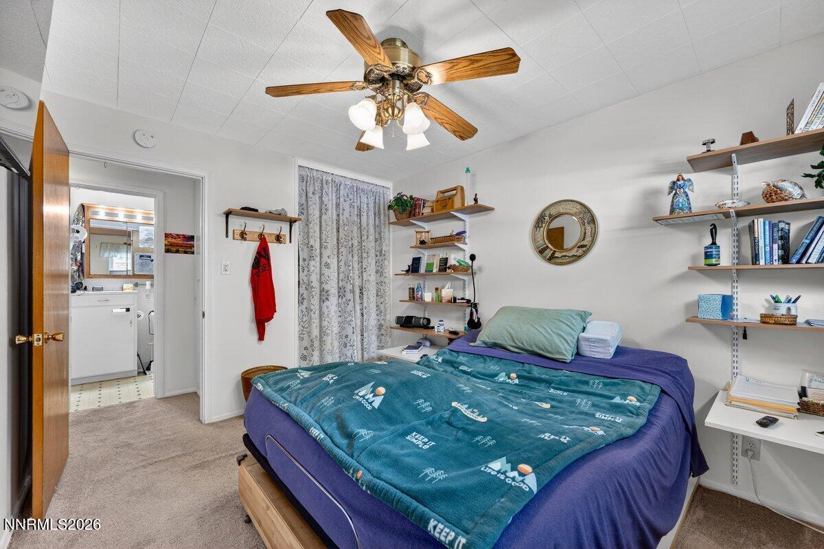 1945 4th Street, Unit 3 Sparks, NV 89431 - Photo 12 of 20 a bedroom with a bed and a chandelier