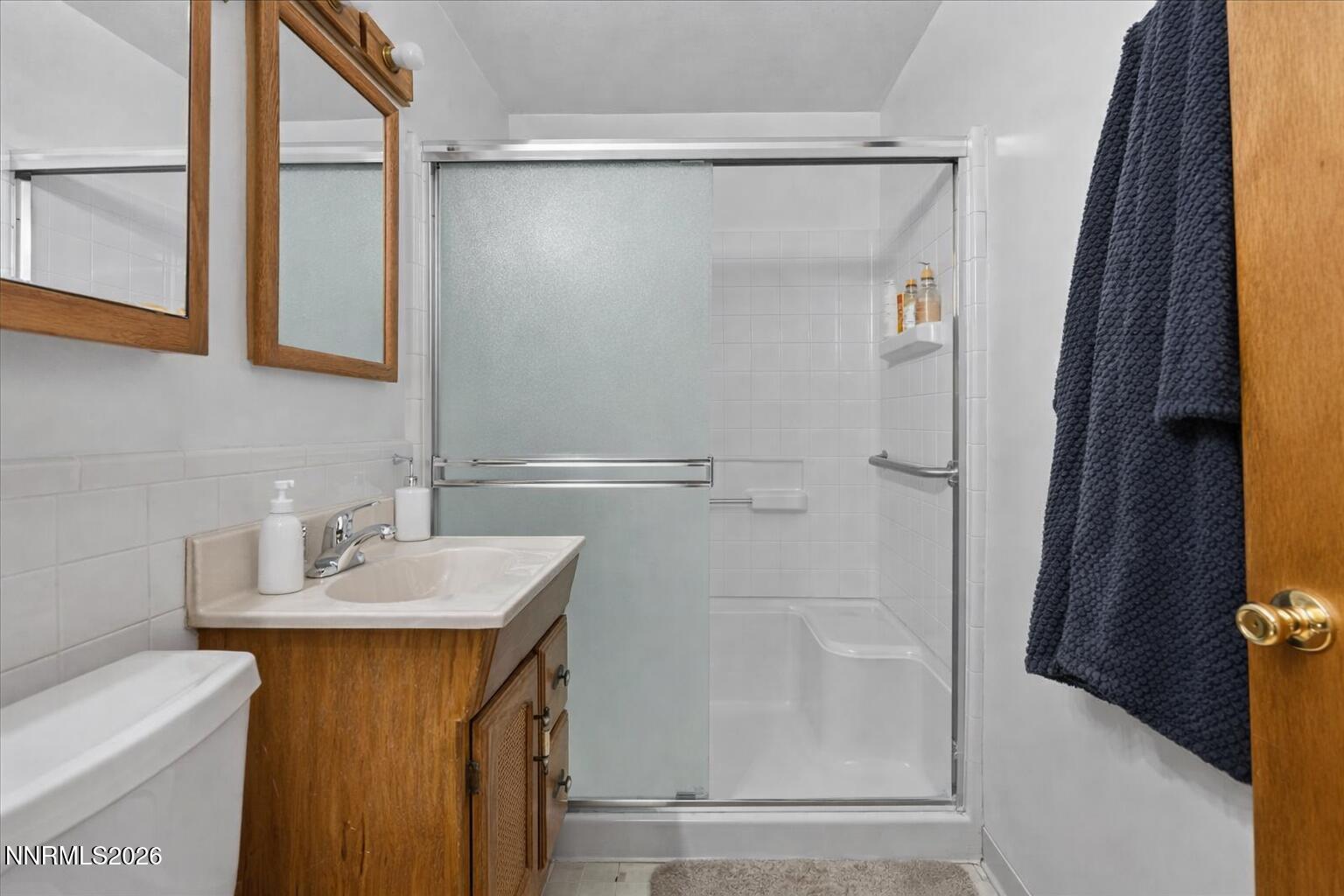 1945 4th Street, Unit 3 Sparks, NV 89431 - Photo 14 of 20 a bathroom with a sink and a mirror