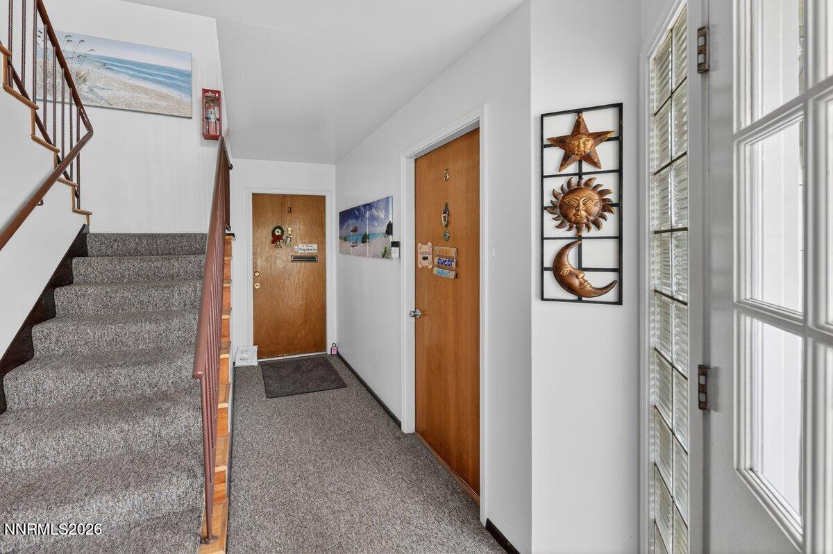 1945 4th Street, Unit 3 Sparks, NV 89431 - Photo 3 of 20 a view of hallway with wooden floor and stairs